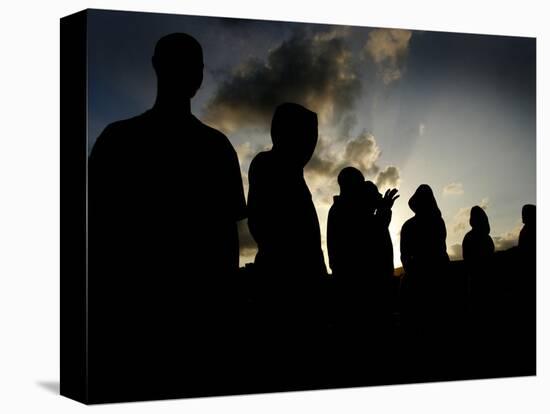 Several Africans Immigrants Chat at Sunset Outside of the Holding Centre for Immigrants-null-Stretched Canvas