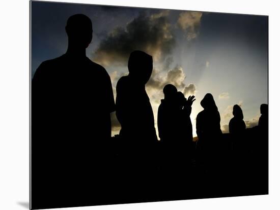 Several Africans Immigrants Chat at Sunset Outside of the Holding Centre for Immigrants-null-Mounted Photographic Print