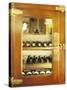 Several Wine Bottles in Wood-Panelled Drinks Cabinet-Peter Medilek-Stretched Canvas