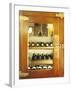 Several Wine Bottles in Wood-Panelled Drinks Cabinet-Peter Medilek-Framed Photographic Print