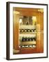 Several Wine Bottles in Wood-Panelled Drinks Cabinet-Peter Medilek-Framed Photographic Print