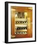 Several Wine Bottles in Wood-Panelled Drinks Cabinet-Peter Medilek-Framed Photographic Print