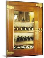 Several Wine Bottles in Wood-Panelled Drinks Cabinet-Peter Medilek-Mounted Photographic Print