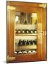 Several Wine Bottles in Wood-Panelled Drinks Cabinet-Peter Medilek-Mounted Photographic Print