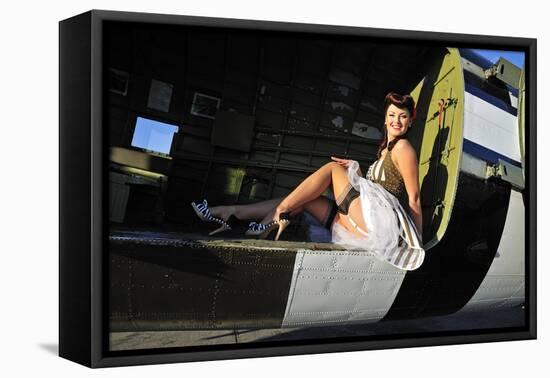 Sexy 1940's Style Pin-Up Girl Sitting Inside of a C-47 Skytrain Aircraft-null-Framed Stretched Canvas