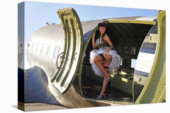 Sexy 1940's Style Pin-Up Girl Standing Inside of a C-47 Skytrain Aircraft-null-Stretched Canvas