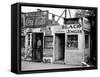 Shack Like Black Jeweler Shop Next to Food Store Covered with Ads in a Slum Section of the City.-Alfred Eisenstaedt-Framed Stretched Canvas