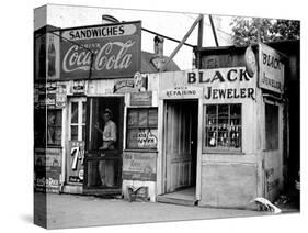 Shack Like Black Jeweler Shop Next to Food Store Covered with Ads in a Slum Section of the City.-Alfred Eisenstaedt-Stretched Canvas