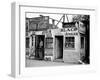 Shack Like Black Jeweler Shop Next to Food Store Covered with Ads in a Slum Section of the City.-Alfred Eisenstaedt-Framed Photographic Print