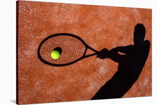 Shadow Of A Tennis Player In Action On A Tennis Court (Conceptual Image With A Tennis Ball-l i g h t p o e t-Stretched Canvas