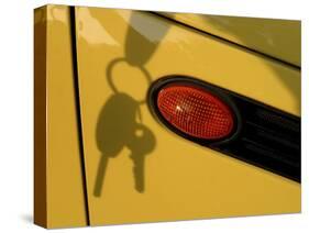 Shadow of Keys Against a Yellow Car-null-Stretched Canvas