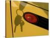 Shadow of Keys Against a Yellow Car-null-Stretched Canvas