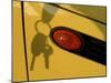 Shadow of Keys Against a Yellow Car-null-Mounted Premium Photographic Print