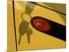 Shadow of Keys Against a Yellow Car-null-Mounted Photographic Print