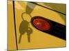 Shadow of Keys Against a Yellow Car-null-Mounted Photographic Print