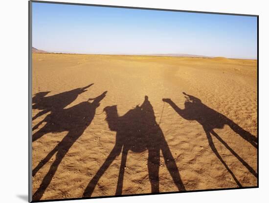 Shadows of people riding camels in a caravan in Zagora Desert, Draa-Tafilalet Region, Morocco-Karol Kozlowski-Mounted Photographic Print