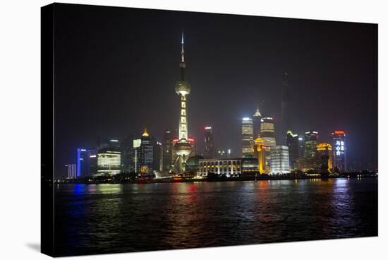 Shanghai, China, Evening Cityscape and Lights with River Reflection-Darrell Gulin-Stretched Canvas