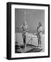 Shapely Sunbather Taking an Outdoor Shower as Woman Preparing for Her Turn, Looks On, at Beach-Alfred Eisenstaedt-Framed Photographic Print