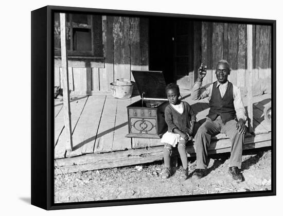 Sharecropper, Lonnie Fair and Daughter Listen to Victrola on Farm in Mississippi-Alfred Eisenstaedt-Framed Stretched Canvas