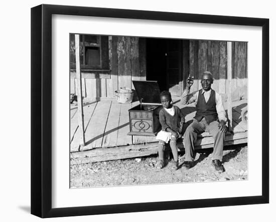 Sharecropper, Lonnie Fair and Daughter Listen to Victrola on Farm in Mississippi-Alfred Eisenstaedt-Framed Photographic Print