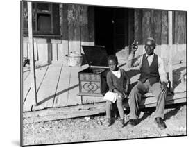 Sharecropper, Lonnie Fair and Daughter Listen to Victrola on Farm in Mississippi-Alfred Eisenstaedt-Mounted Photographic Print