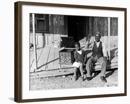 Sharecropper, Lonnie Fair and Daughter Listen to Victrola on Farm in Mississippi-Alfred Eisenstaedt-Framed Photographic Print