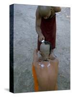 Shaving Head of a Novice Monk, Buddhist Monastery at Angkor, Siem Reap, Cambodia-Bruno Morandi-Stretched Canvas