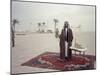 Sheik Shakbut Bin Sultan Al Nahyan Standing in Front of His Palace Holding a Falcon, 1963-Ralph Crane-Mounted Photographic Print