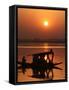 Shikara, or Kashmiri Boat, in Dal Lake as the Sun Sets in Srinagar, India-Mukhtar Khan-Framed Stretched Canvas
