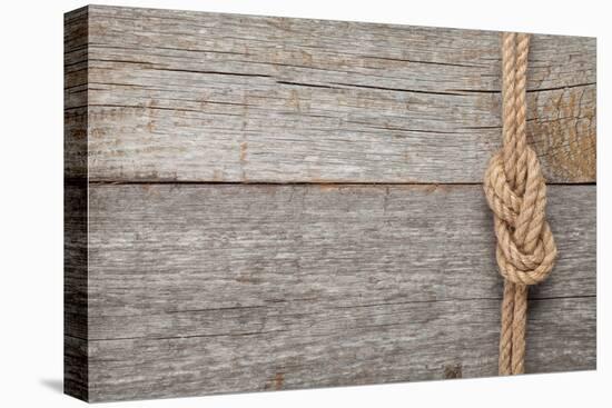 Ship Rope Knot on Old Wooden Texture Background-karandaev-Stretched Canvas