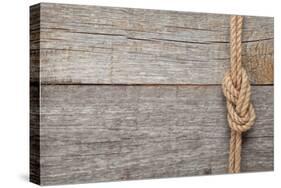 Ship Rope Knot on Old Wooden Texture Background-karandaev-Stretched Canvas