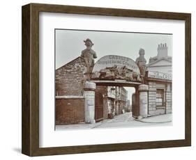 Ships Figureheads over the Gate at Castles Shipbreaking Yard, Westminster, London, 1909-null-Framed Photographic Print