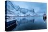 Ships Moored in the Small Harbor of Reine under a Gloomy Sky in the South of the Lofoten Islands-Roberto Moiola-Stretched Canvas