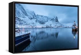 Ships Moored in the Small Harbor of Reine under a Gloomy Sky in the South of the Lofoten Islands-Roberto Moiola-Framed Stretched Canvas