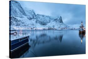 Ships Moored in the Small Harbor of Reine under a Gloomy Sky in the South of the Lofoten Islands-Roberto Moiola-Stretched Canvas