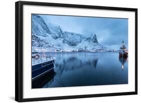 Ships Moored in the Small Harbor of Reine under a Gloomy Sky in the South of the Lofoten Islands-Roberto Moiola-Framed Photographic Print
