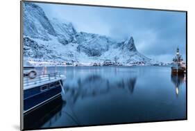 Ships Moored in the Small Harbor of Reine under a Gloomy Sky in the South of the Lofoten Islands-Roberto Moiola-Mounted Photographic Print