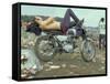 Shirtless Man in Levi Strauss Jeans Lying on Motorcycle Seat at Woodstock Music Festival-Bill Eppridge-Framed Stretched Canvas