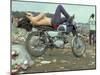 Shirtless Man in Levi Strauss Jeans Lying on Motorcycle Seat at Woodstock Music Festival-Bill Eppridge-Mounted Premium Photographic Print