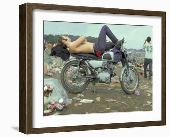 Shirtless Man in Levi Strauss Jeans Lying on Motorcycle Seat at Woodstock Music Festival-Bill Eppridge-Framed Photographic Print