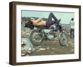 Shirtless Man in Levi Strauss Jeans Lying on Motorcycle Seat at Woodstock Music Festival-Bill Eppridge-Framed Photographic Print