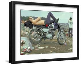 Shirtless Man in Levi Strauss Jeans Lying on Motorcycle Seat at Woodstock Music Festival-Bill Eppridge-Framed Photographic Print