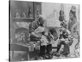 Shoemaker Preparing Shoes for Young Boy-null-Stretched Canvas