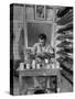 Shoemaker Sitting in His Shop Working on a Pair of Old Work Shoes-John Phillips-Stretched Canvas