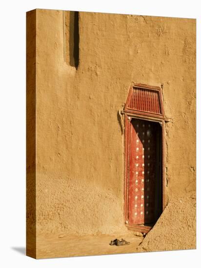 Shoes outside side door into the Mosque at Djenne, Mali, West Africa-Janis Miglavs-Stretched Canvas