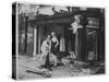 Shop Owner Poses with Two Mannequins Following the Destruction of His Shop by German Bombers-null-Stretched Canvas