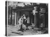 Shop Owner Poses with Two Mannequins Following the Destruction of His Shop by German Bombers-null-Stretched Canvas