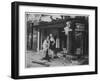 Shop Owner Poses with Two Mannequins Following the Destruction of His Shop by German Bombers-null-Framed Photographic Print