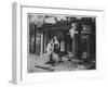 Shop Owner Poses with Two Mannequins Following the Destruction of His Shop by German Bombers-null-Framed Photographic Print