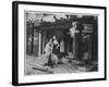 Shop Owner Poses with Two Mannequins Following the Destruction of His Shop by German Bombers-null-Framed Photographic Print